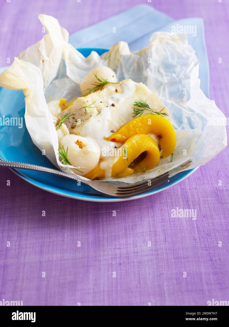 Cod with exotic fruit cooked in wax paper Stock Photo - Alamy