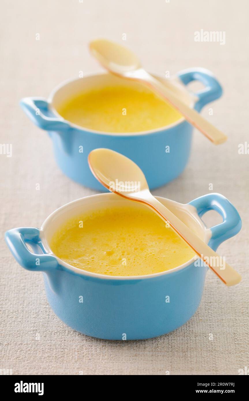 Orange blossom waterflavored baked egg custards Stock Photo Alamy