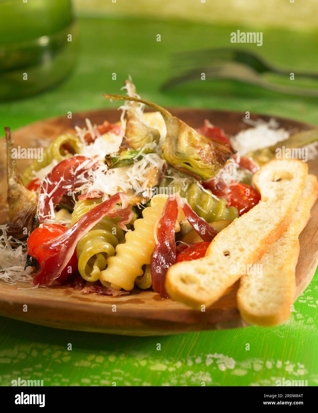 Pasta with artichokes and Spanish ham Stock Photo Alamy