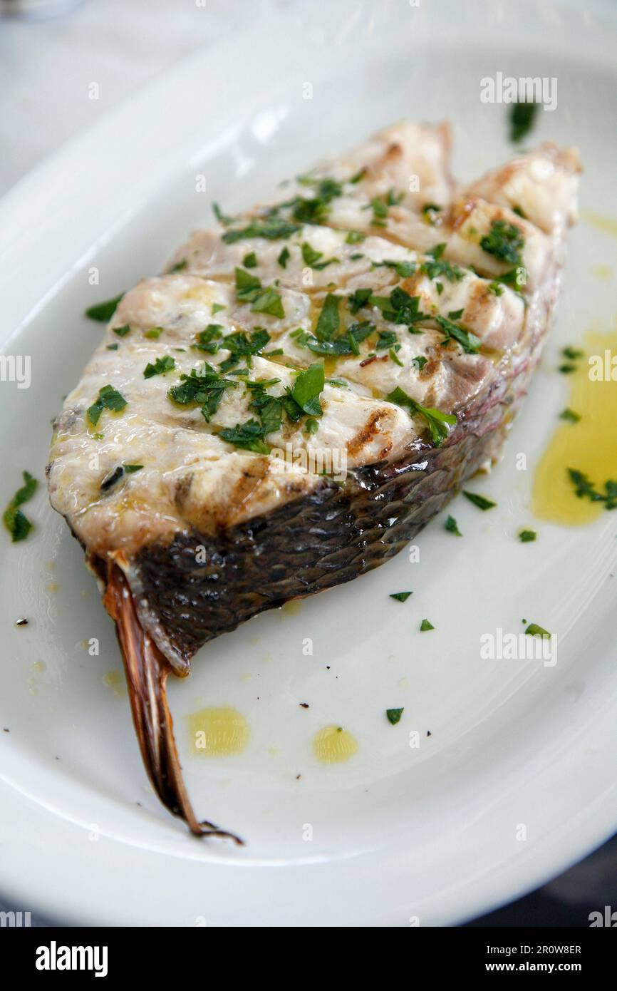 Fish Part Steak Fish steak grilled on the barbecue with herbs Stock Photo - Alamy