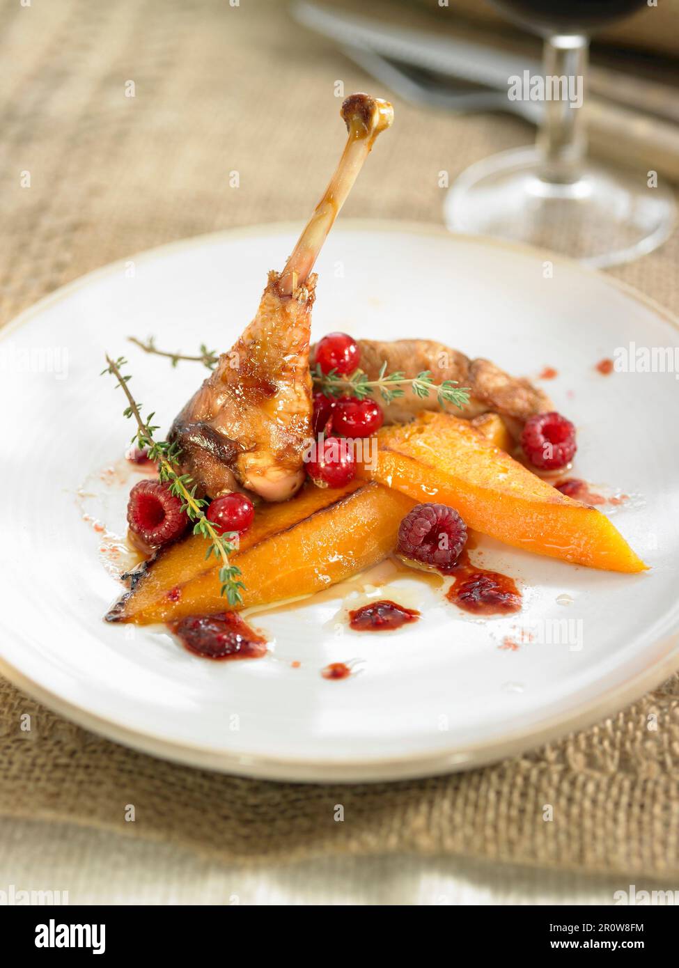 Pheasant with stewed pumpkin and summer fruit Stock Photo
