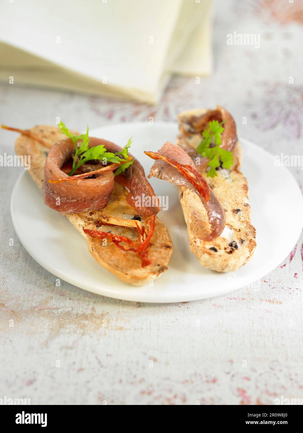 Anchovy fillets on toast Stock Photo Alamy