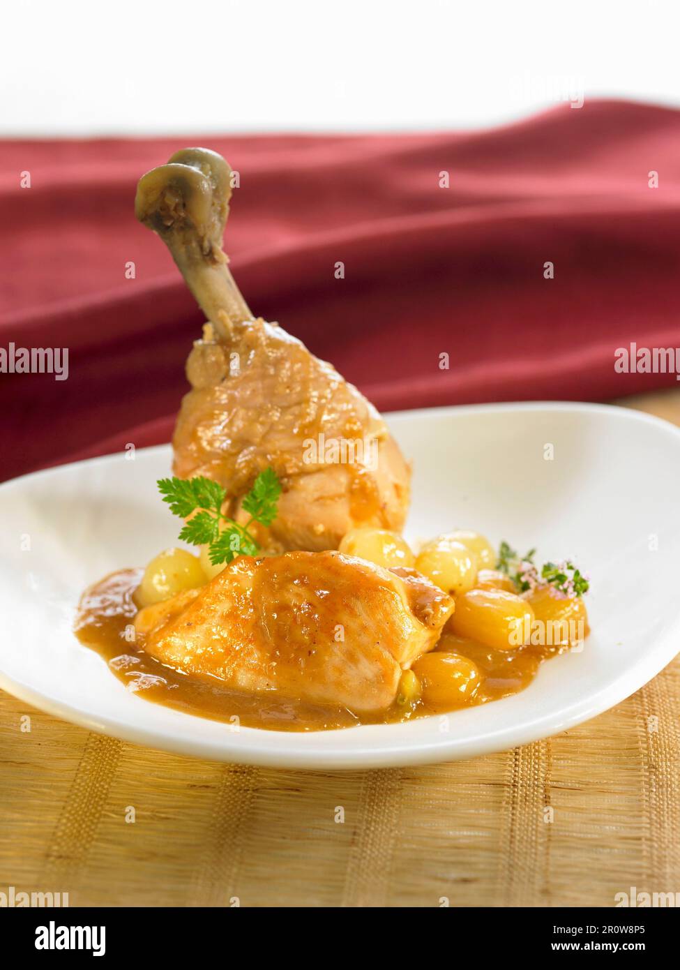Capon with white grapes and Port and white wine sauce Stock Photo