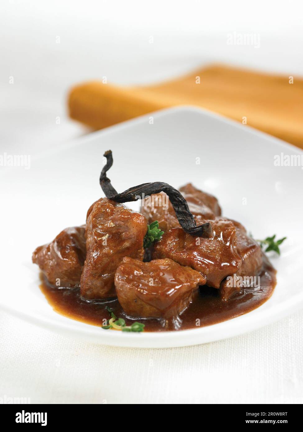 Spanish pork cooked in red wine with vanilla Stock Photo Alamy