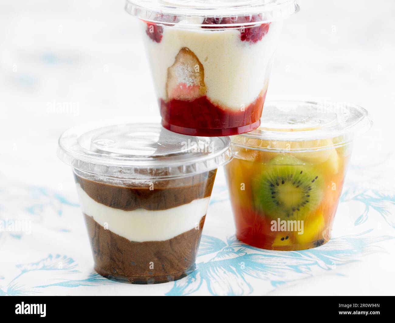 Three different desserts in takeaway plastic containers Stock Photo
