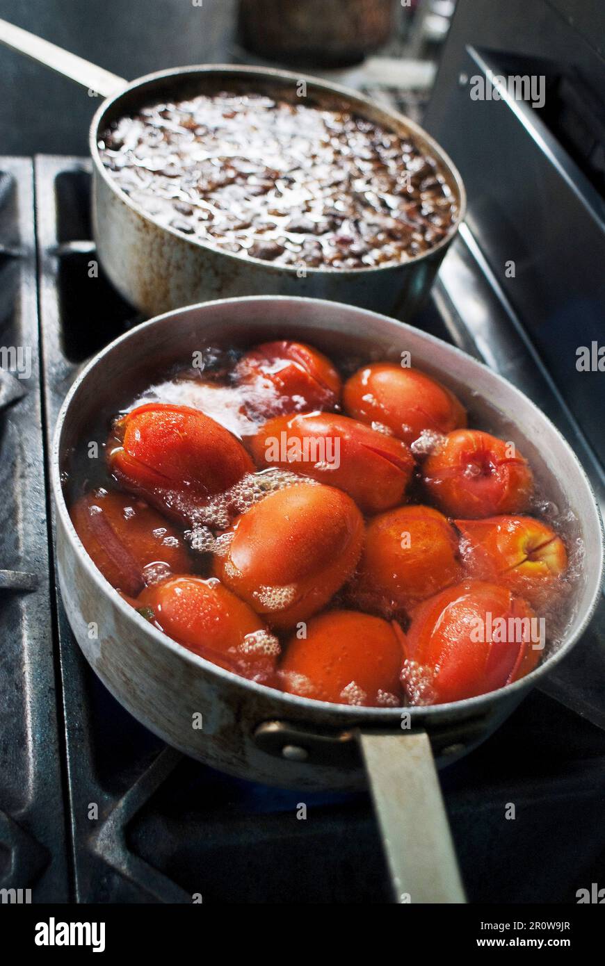 Cooking tomatoes and beans Stock Photo - Alamy