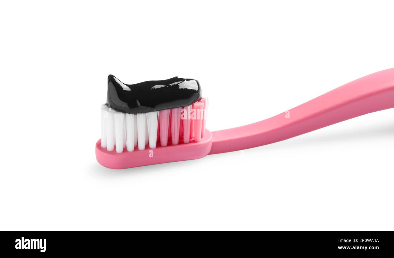 Brush with charcoal toothpaste isolated on white Stock Photo - Alamy