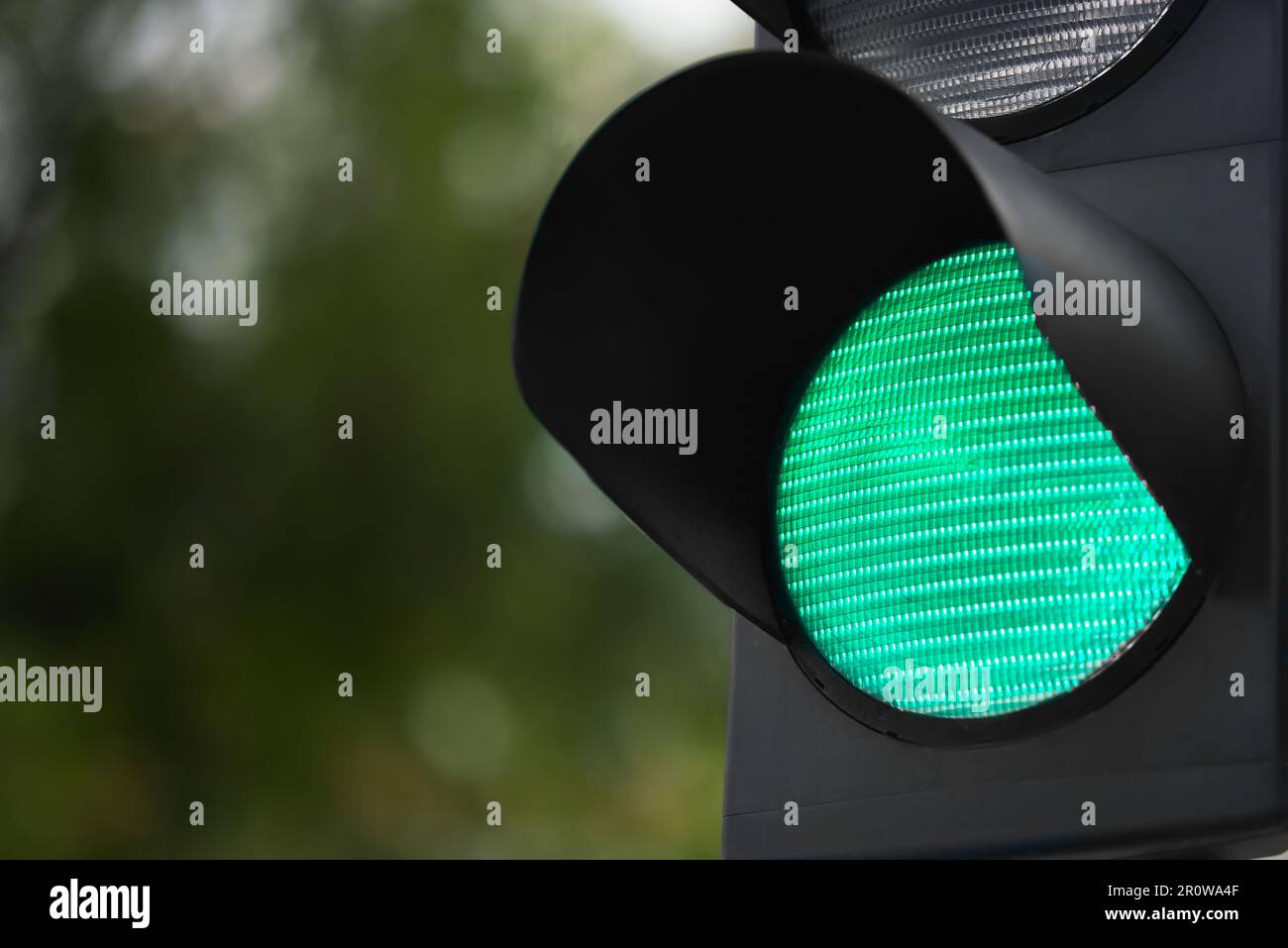 Closeup view of green traffic light in city. Space for text Stock Photo ...