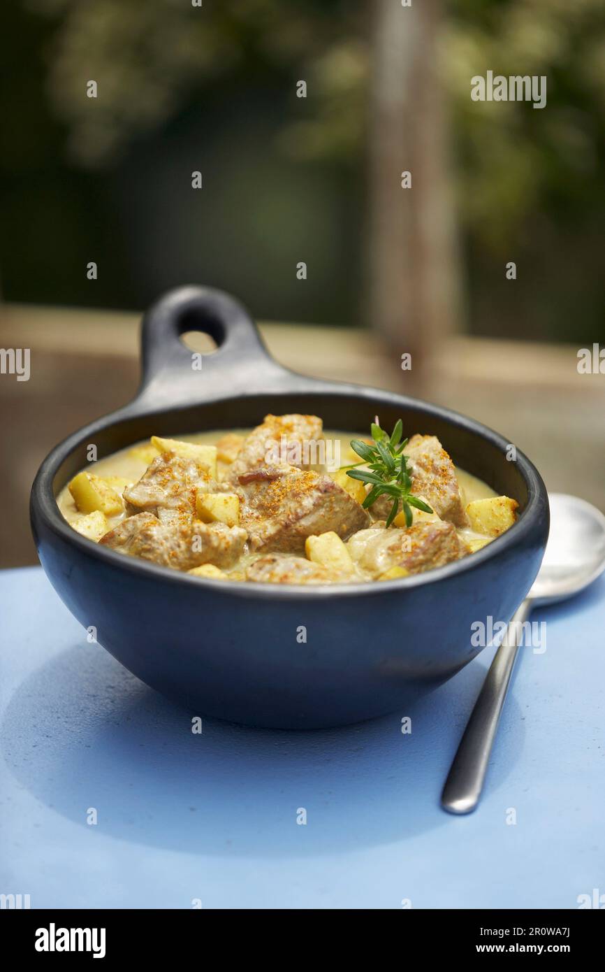 Shoulder of lamb and potato curry Stock Photo - Alamy