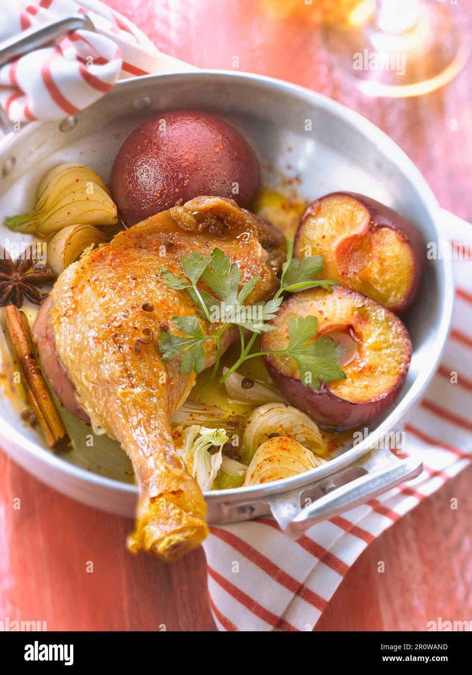 Roasted duck's leg with plums and spicies Stock Photo Alamy