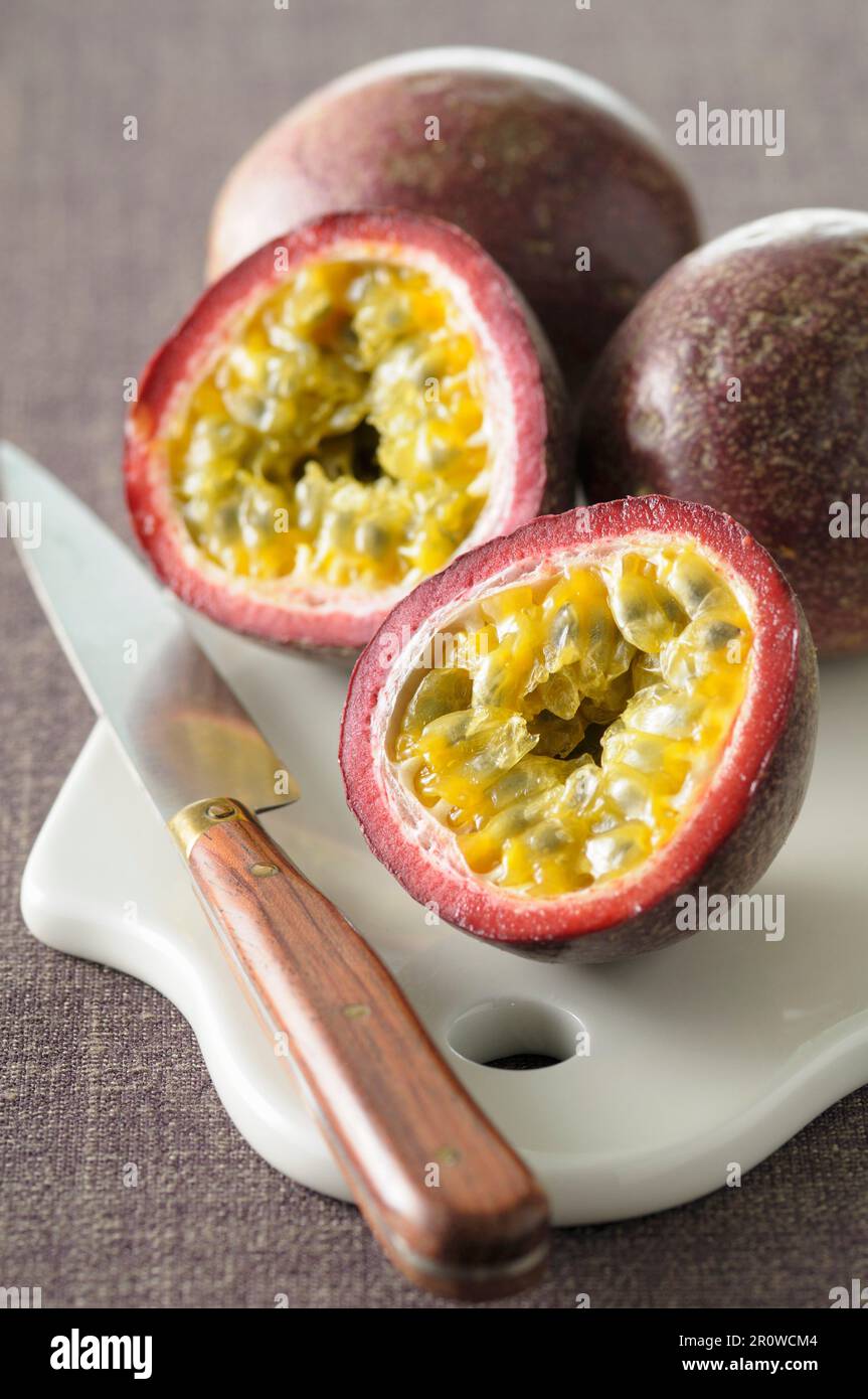 Passion fruit cut in half Stock Photo Alamy