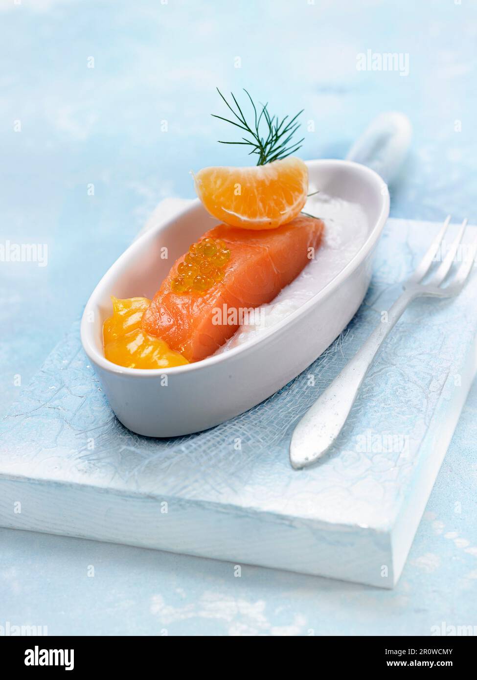 Salmon with mandarin puree and coconut puree Stock Photo