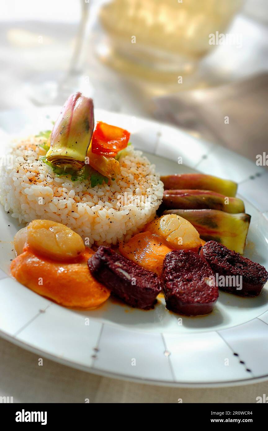 Rice with blood sausage and scallops Stock Photo Alamy