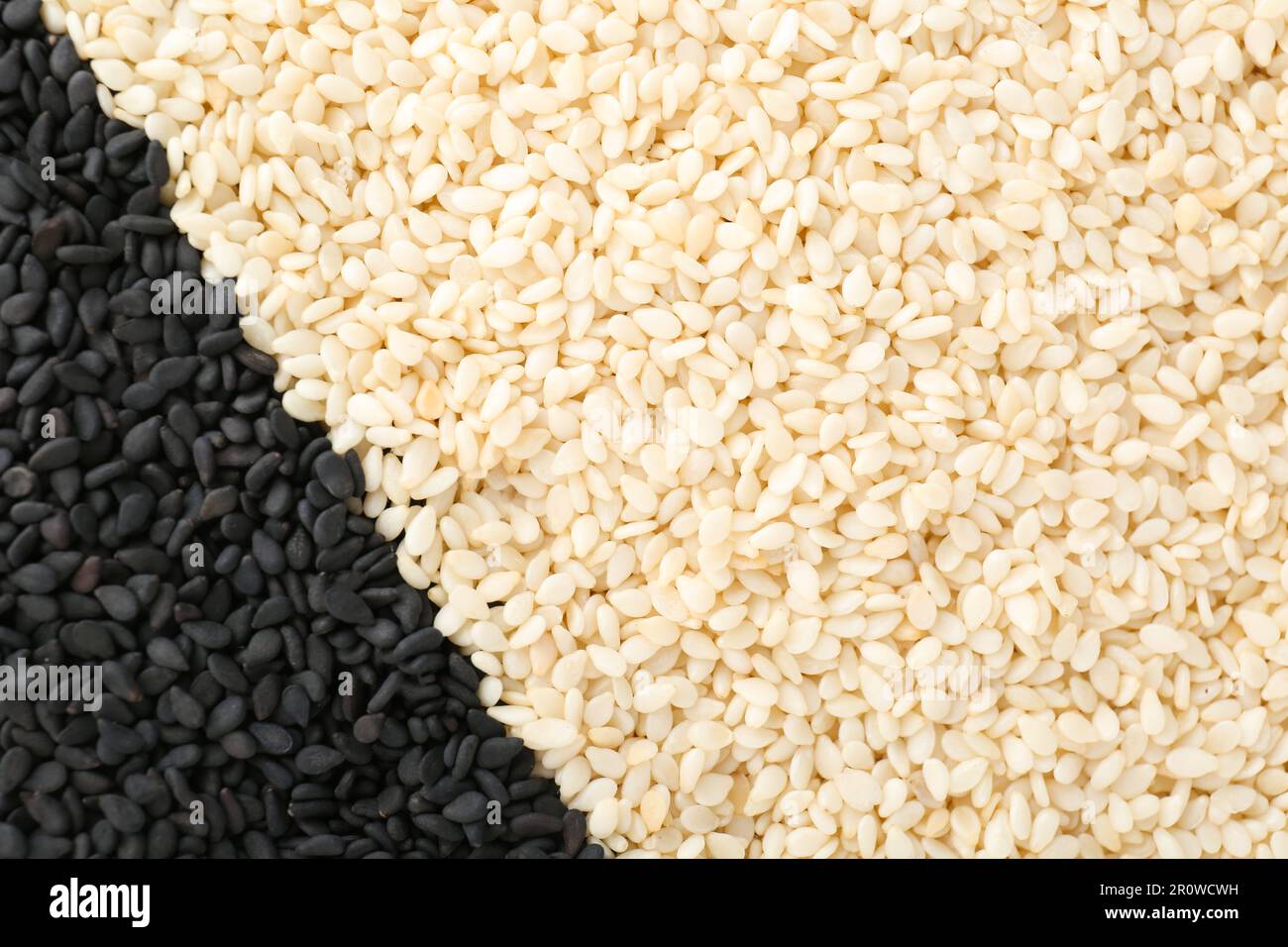 Black and white sesame seeds as background, top view Stock Photo Alamy