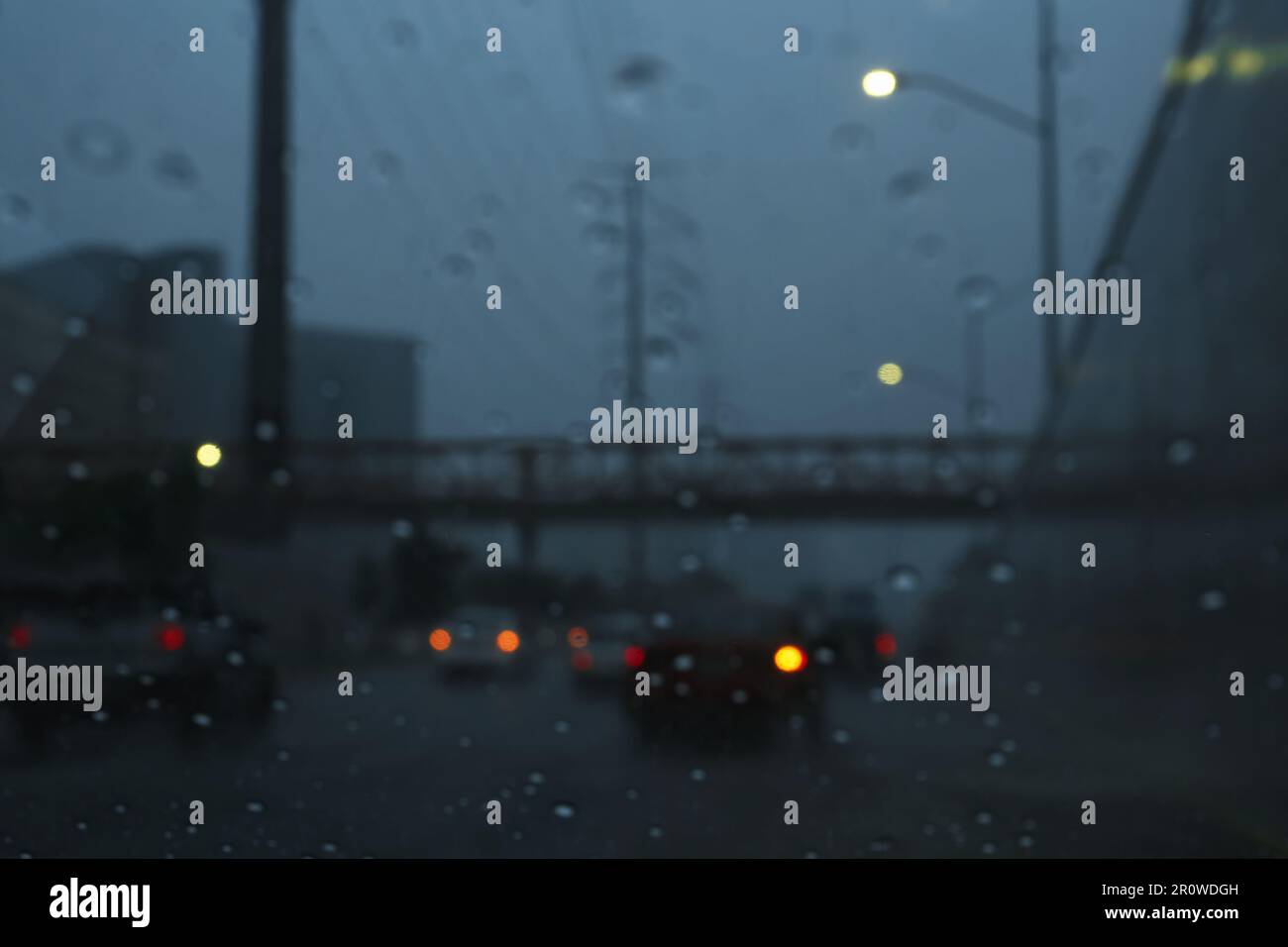 Road on rainy day, view through car window with water drops Stock Photo ...