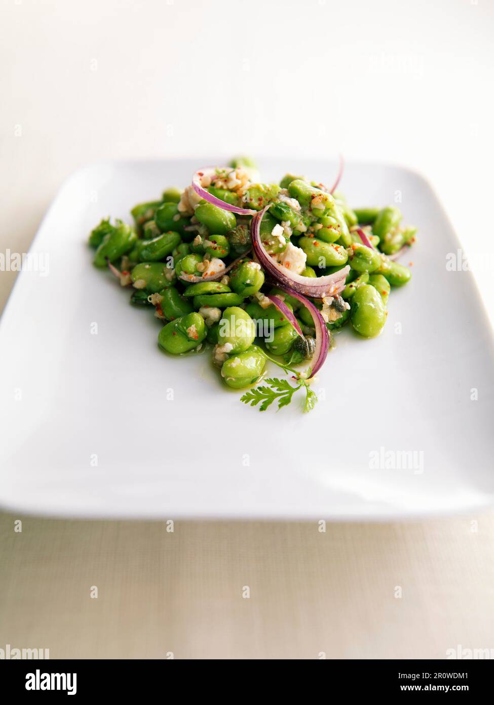 Broad bean, feta and paprika salad Stock Photo Alamy