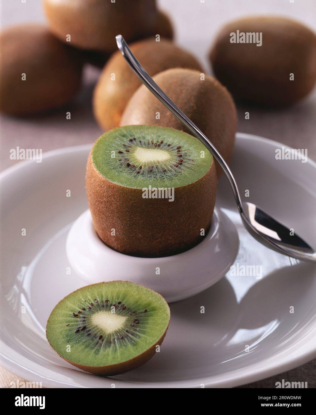 Serving a kiwi in an eggcup Stock Photo Alamy