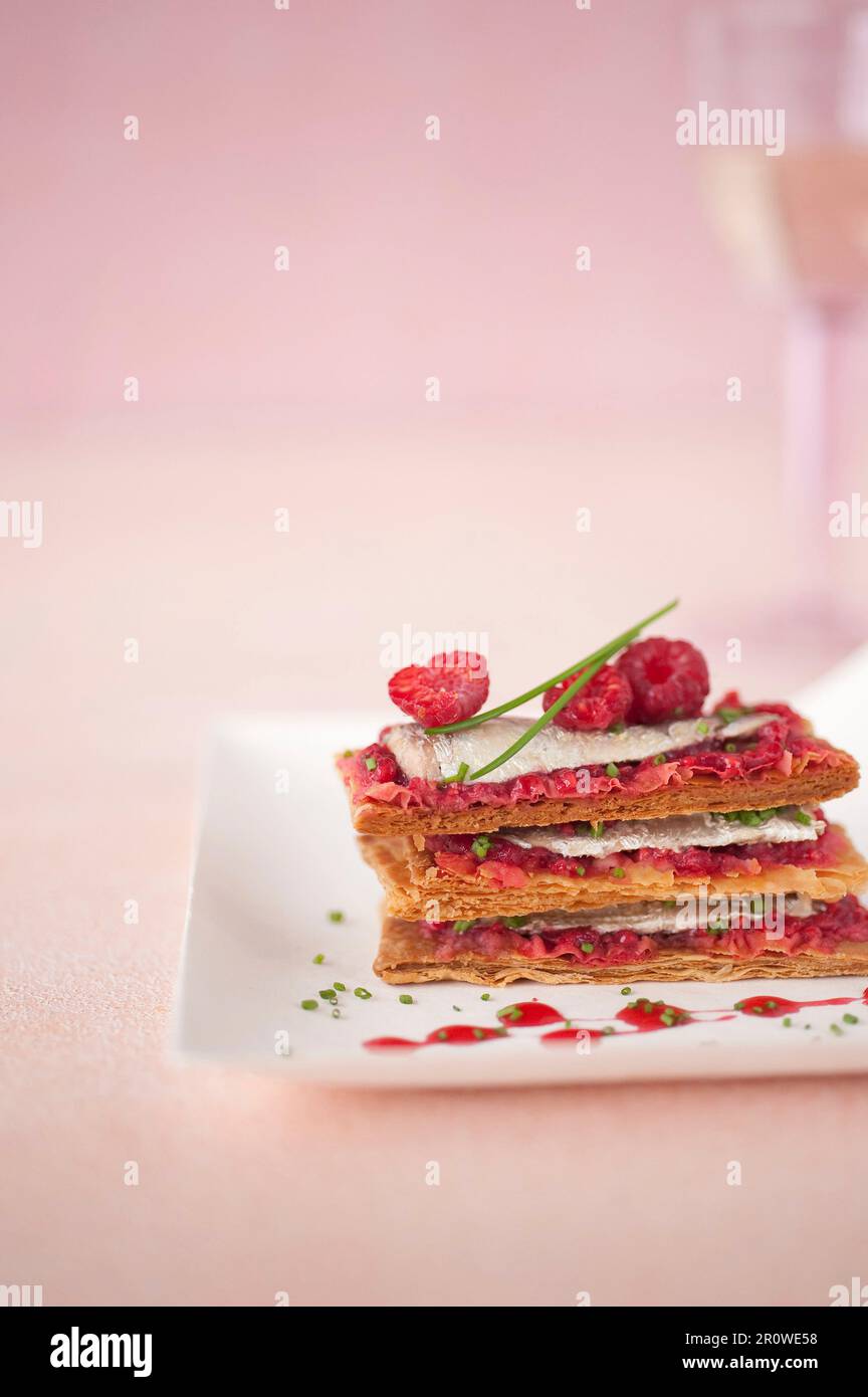 Sardine and raspberry Mille-feuille Stock Photo