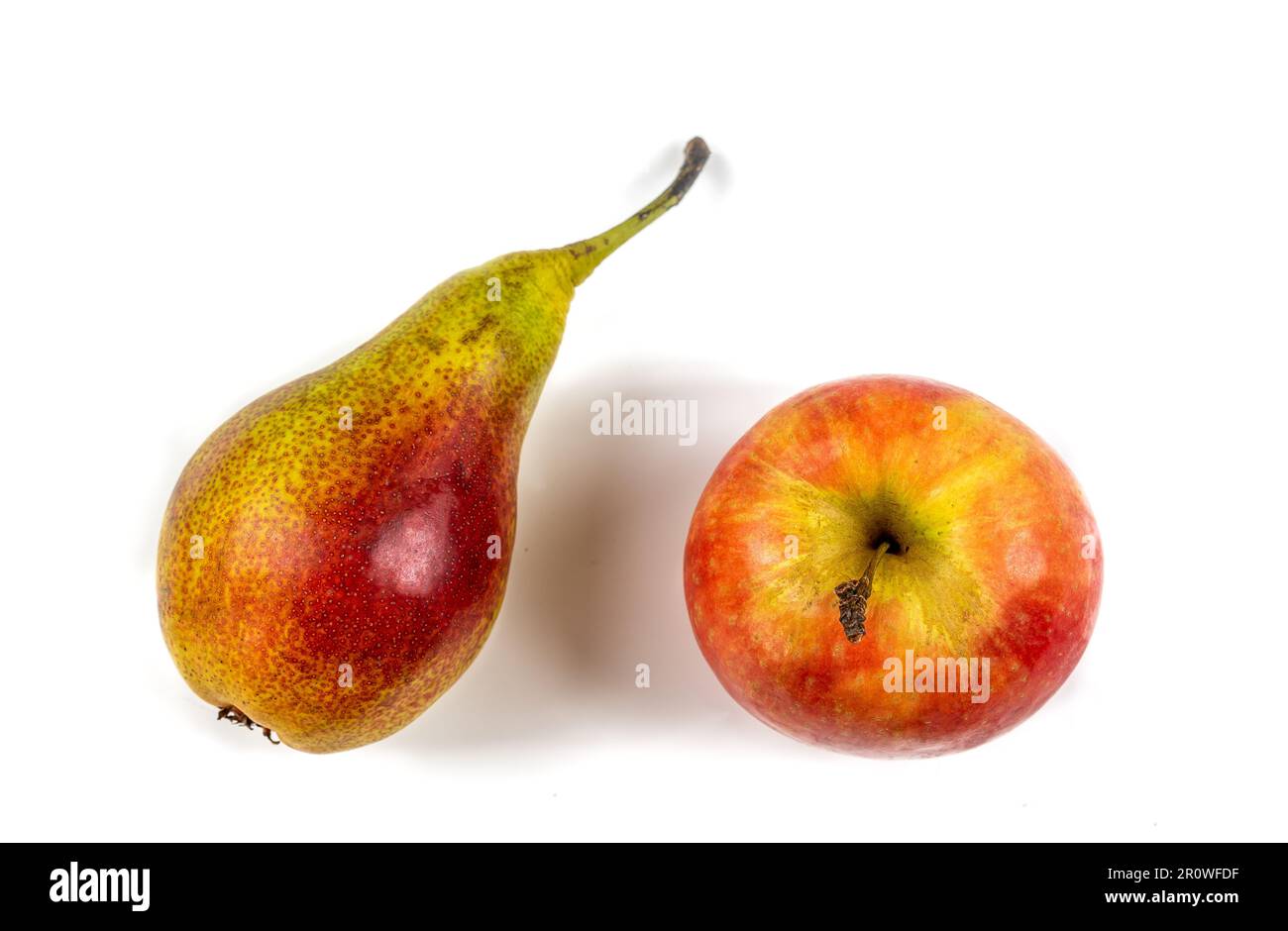 Apple and pear side by side on a white background Stock Photo