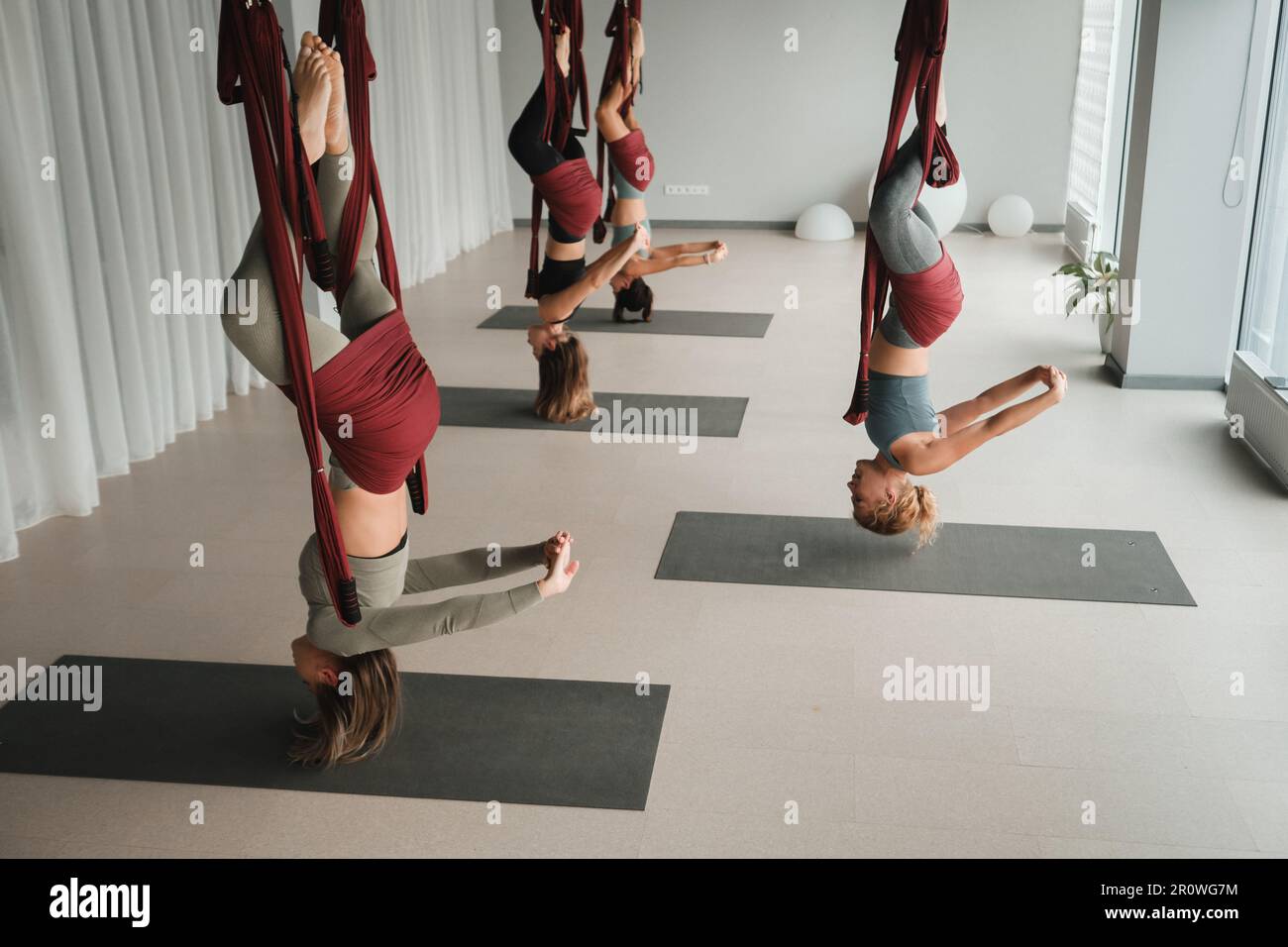 Woman suspended upside down in hi-res stock photography and images - Alamy