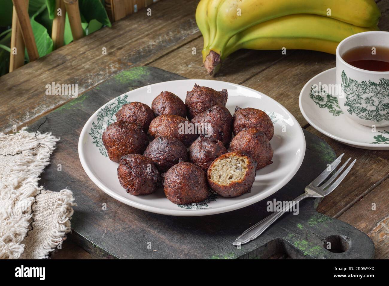 Malaysian fritter snack deep fried banana balls or Malay as Cekodok Pisang Stock Photo