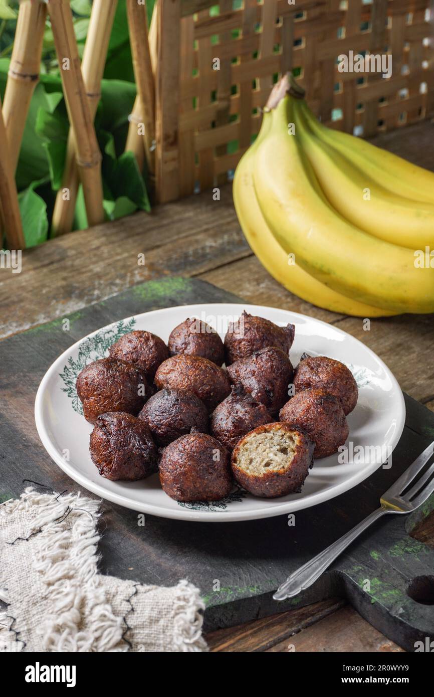 Malaysian fritter snack deep fried banana balls or Malay as Cekodok Pisang Stock Photo