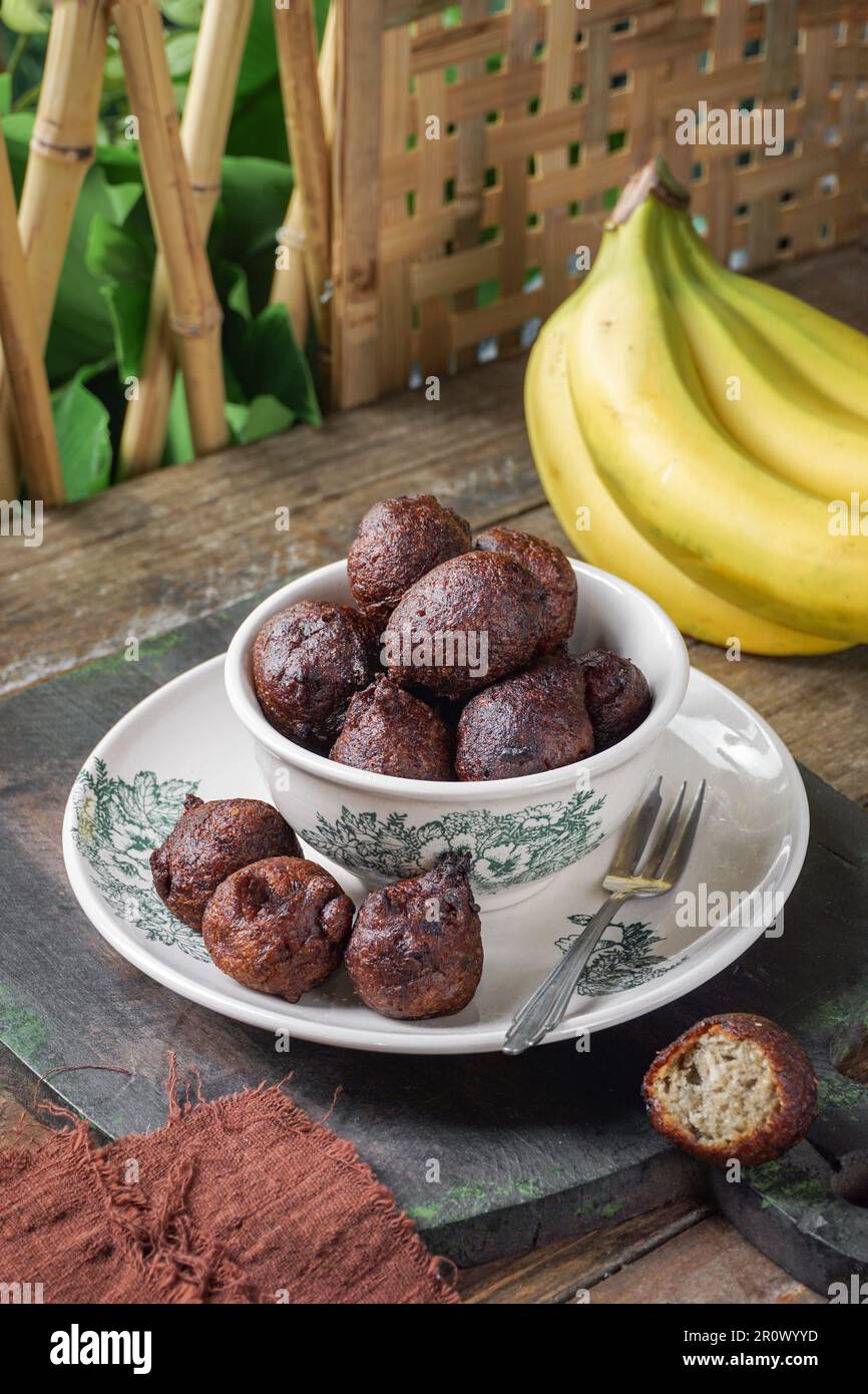Malaysian fritter snack deep fried banana balls or Malay as Cekodok Pisang Stock Photo