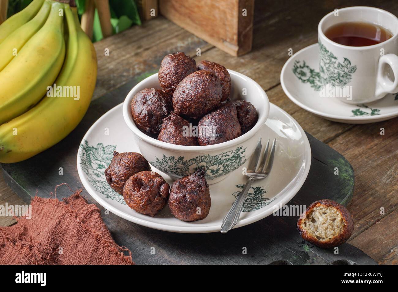 Malaysian fritter snack deep fried banana balls or Malay as Cekodok Pisang Stock Photo