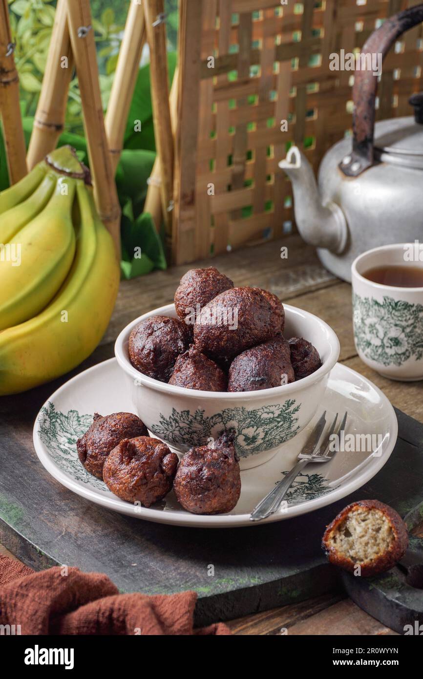 Malaysian fritter snack deep fried banana balls or Malay as Cekodok Pisang Stock Photo