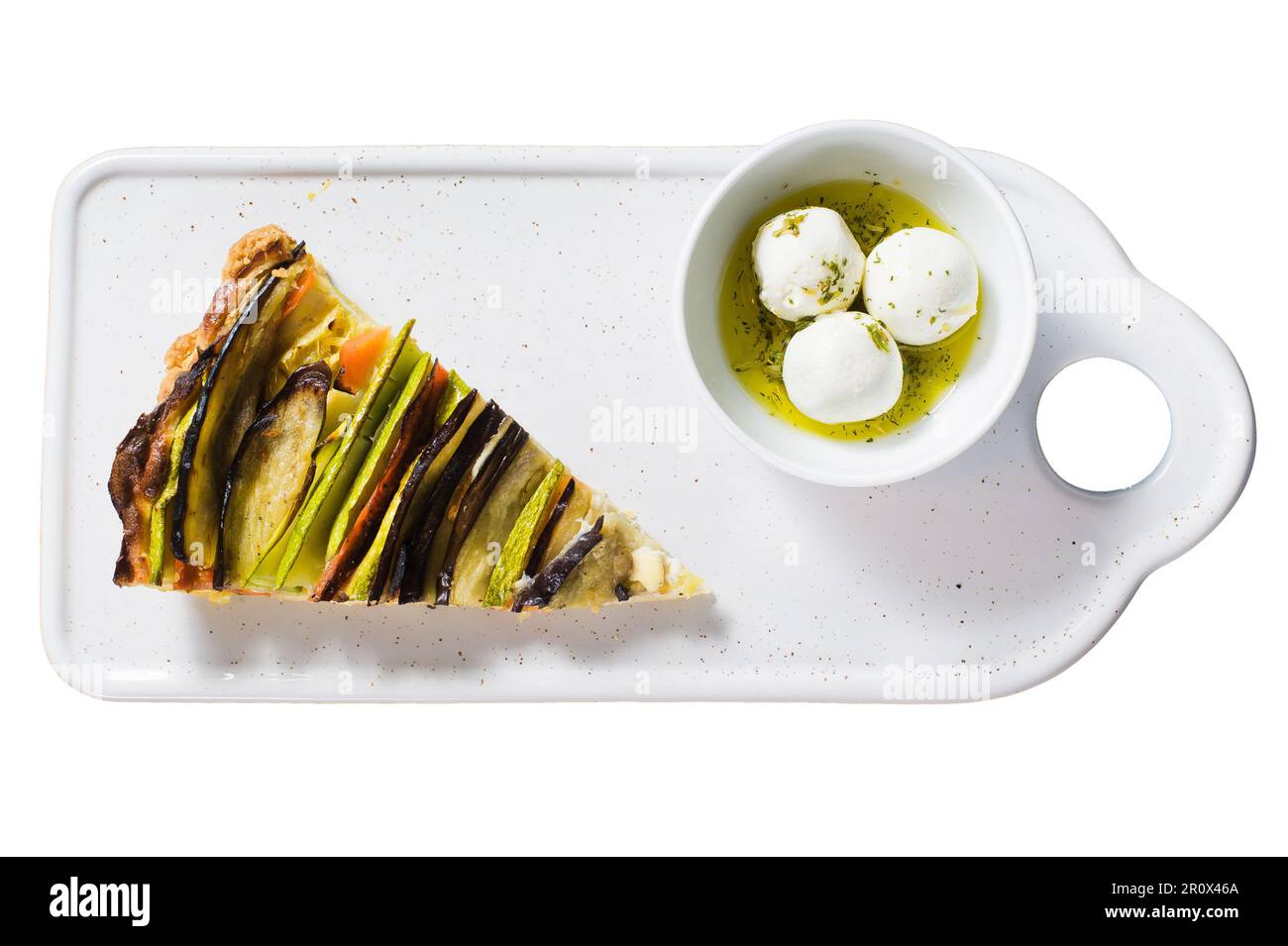 Traditional French Ratatouille, goat cheese in spices and olive oil