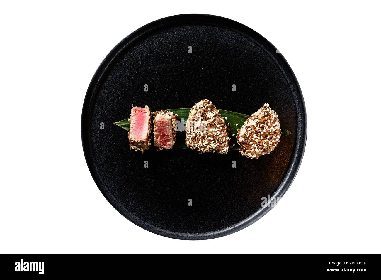 Grilled tuna steak in sesame seeds. Isolated on white background Stock