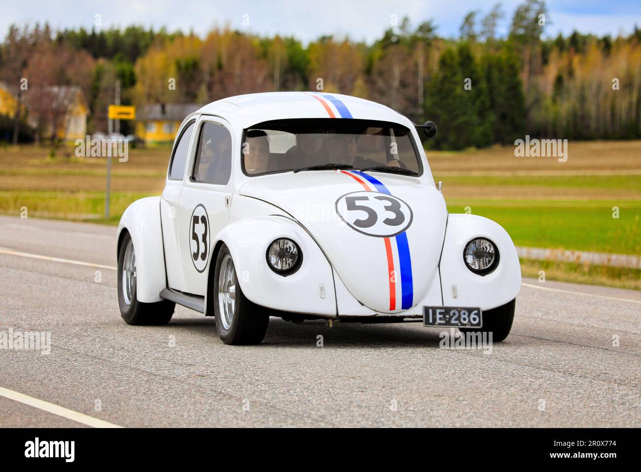 Herbie the Love Bug Volkswagen Beetle, 1965, Volkswagen Type 1, driving along Highway 110 on May Day car cruising event. Salo, Finland. May 1, 2023. Stock Photo