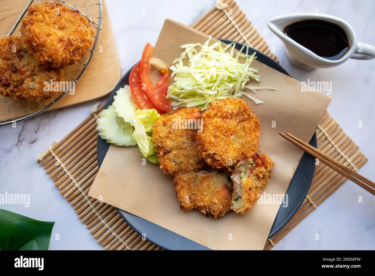 Korokke Japanese appetizer of deep fried mashed potatoes, crab sticks