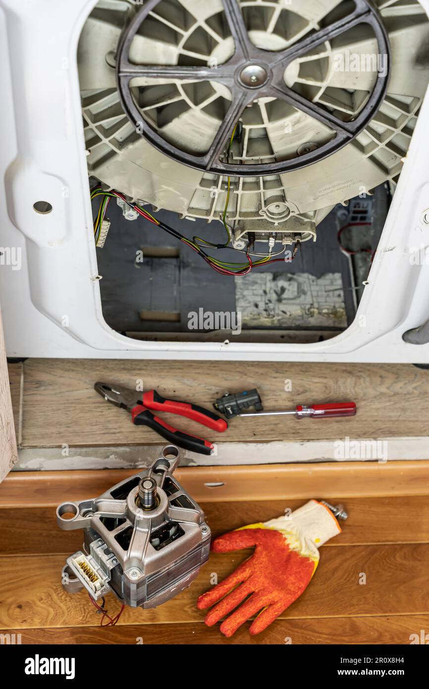 process of repairing the electric motor of a washing machine Stock