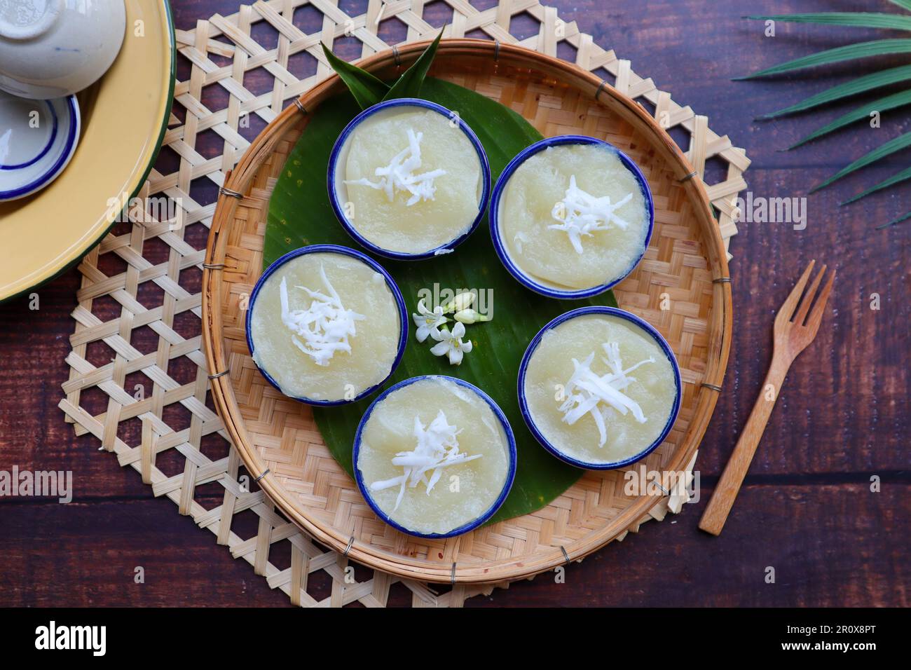 Steamed Cassava cake top with coconut at top view - Thai dessert called Kamon Mun Stock Photo