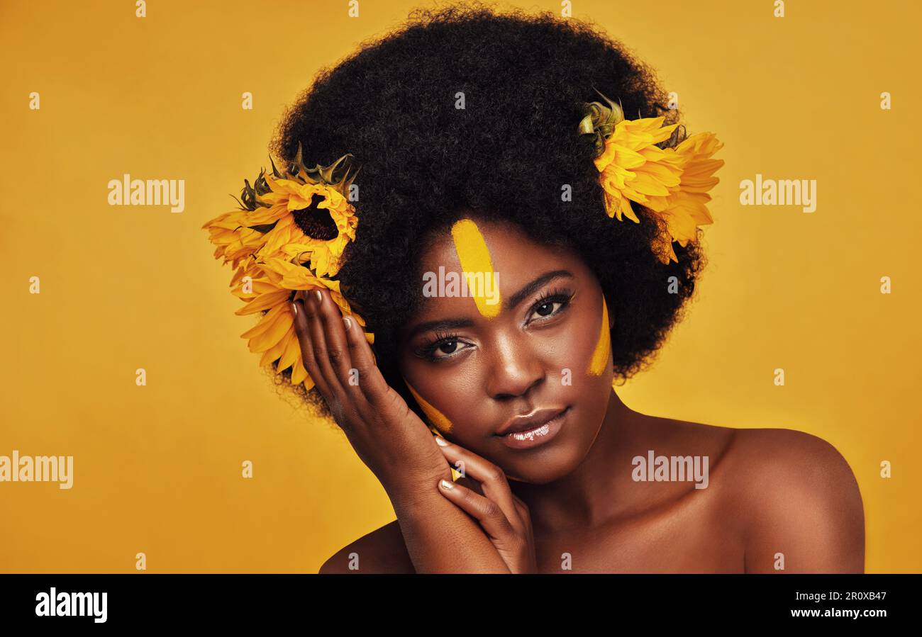 Makeup, sunflower and art with portrait of black woman in studio for ...