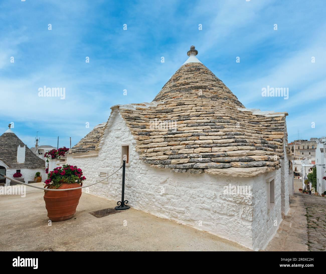 Trulli houses in main touristic district of Alberobello beautiful old historic town, Apulia region, Southern Italy Stock Photo
