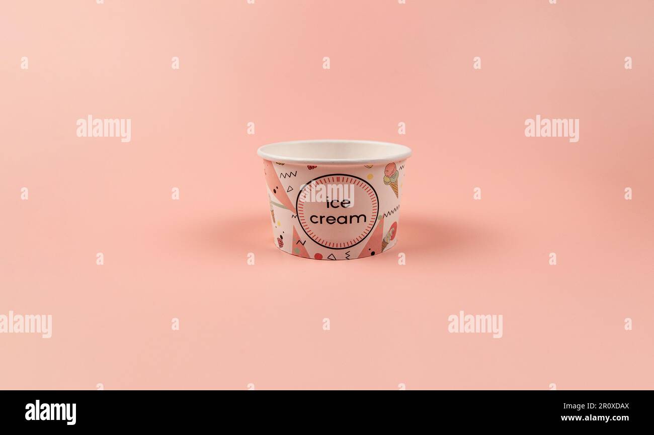 Ice cream cup on pink background. One empty ice cream cup. Copy space