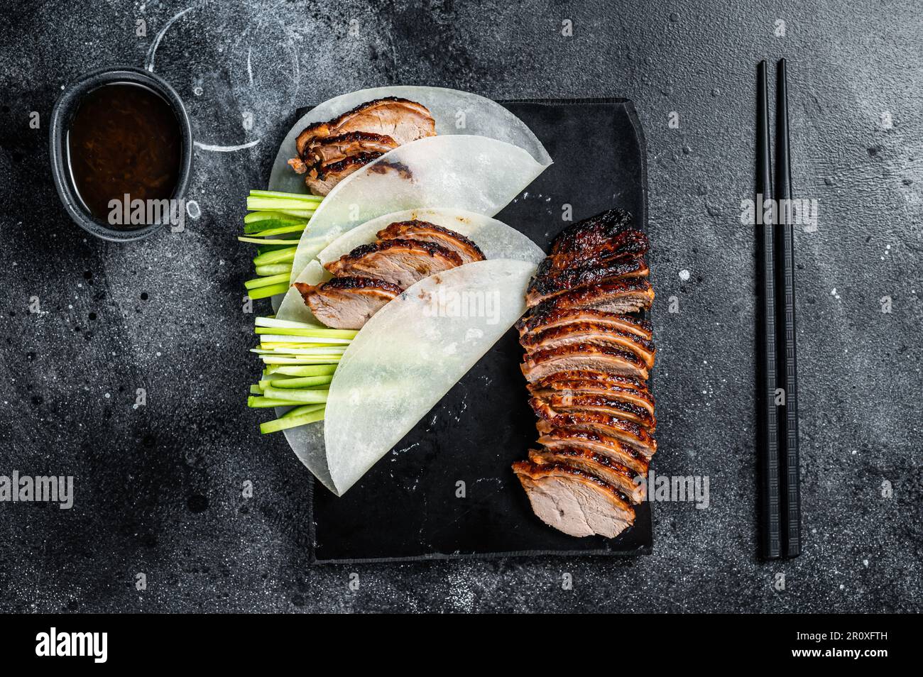 Traditional served Peking Duck with cucumber, green onion, in wheaten