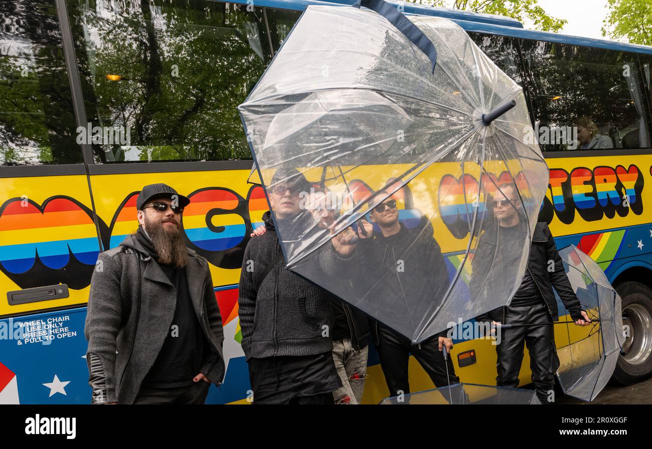 Liverpool, UK. 10th May, 2023. The German group at the Eurovision Song Contest (ESC), 'Lord of the Lost', stand during a city tour in the footsteps of the Beatles, in front of a tour bus with the inscription 'Magical Mystery Tour'. The band will compete in the final of the ESC 2023 on 13.05.2023. Credit: Peter Kneffel/dpa/Alamy Live News Stock Photo