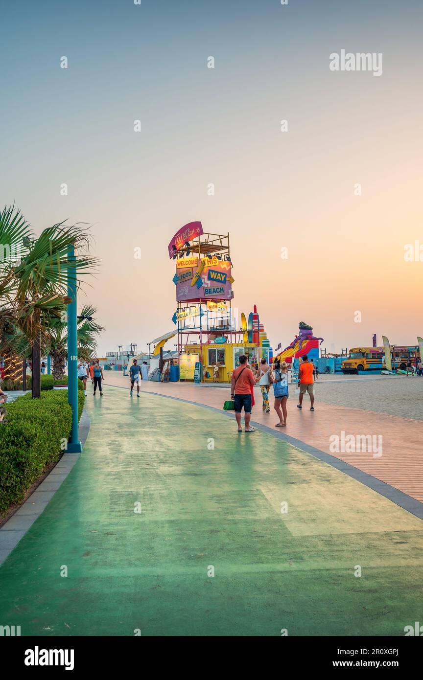 Dubai, United Arab Emirates, March 24, 2021: Kite beach in Dubai with large running track, coffee bars and restaurants by the seaside at sunset at one Stock Photo