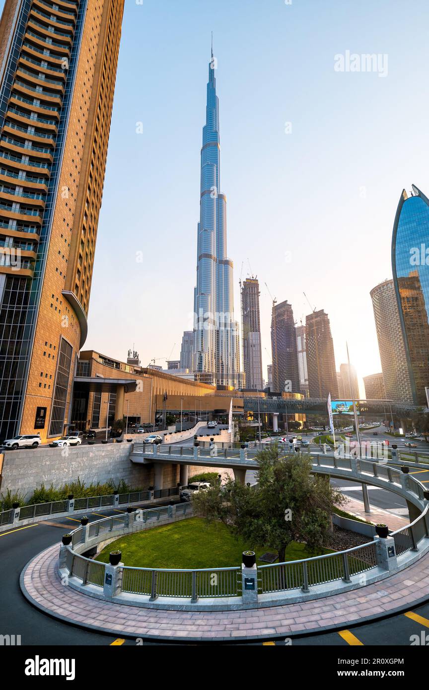 Dubai, United Arab Emirates - April 19, 2021: Dubai mall and Burj Khalifa modern architecture and downtown city streets area streets at scenic sunset Stock Photo