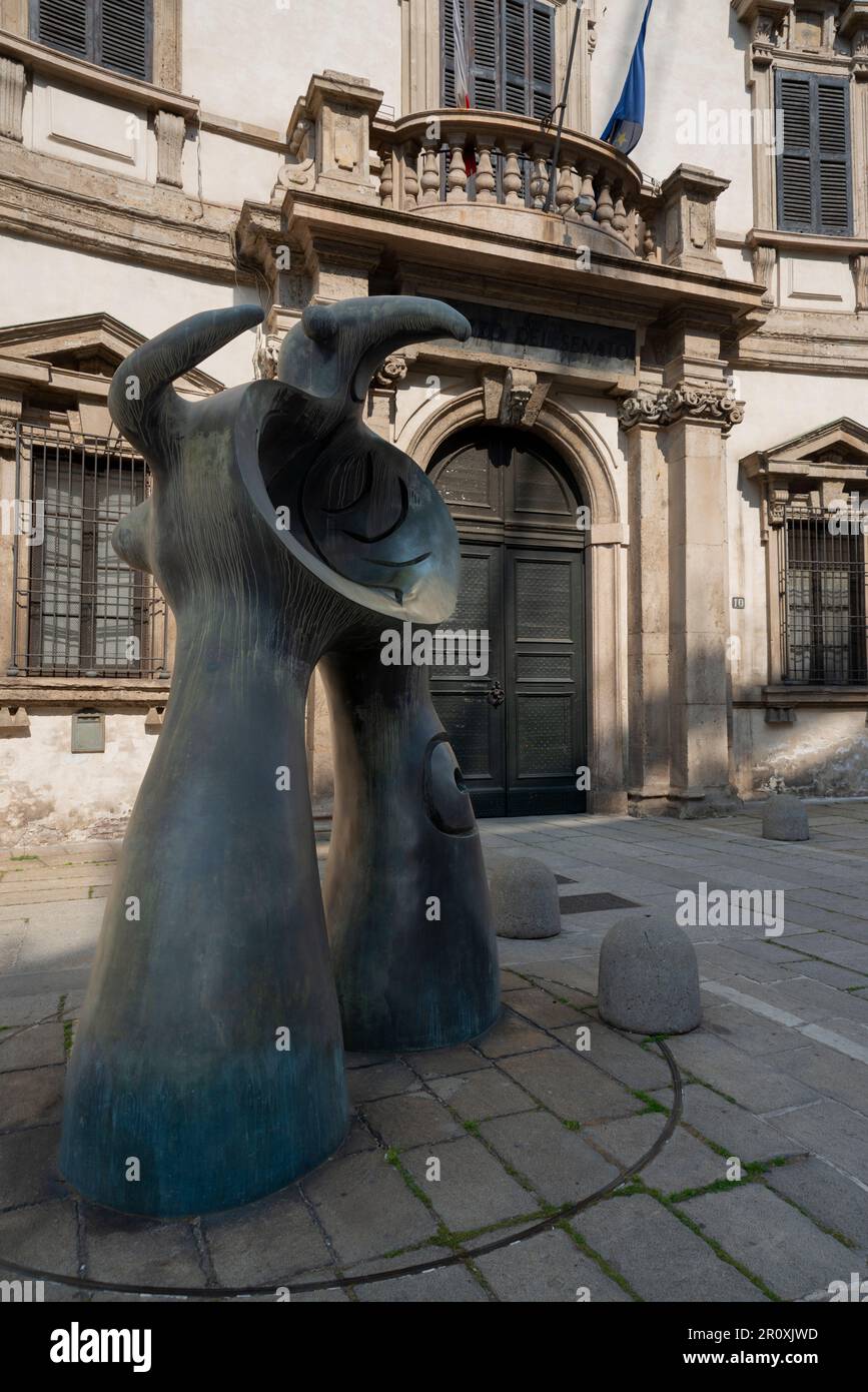Italy, Lombardy, Milan, Via Senato Street, Sculpture Mère Ubu by Joan Mirò dated 1975 background Palazzo del Senato Palace Stock Photo