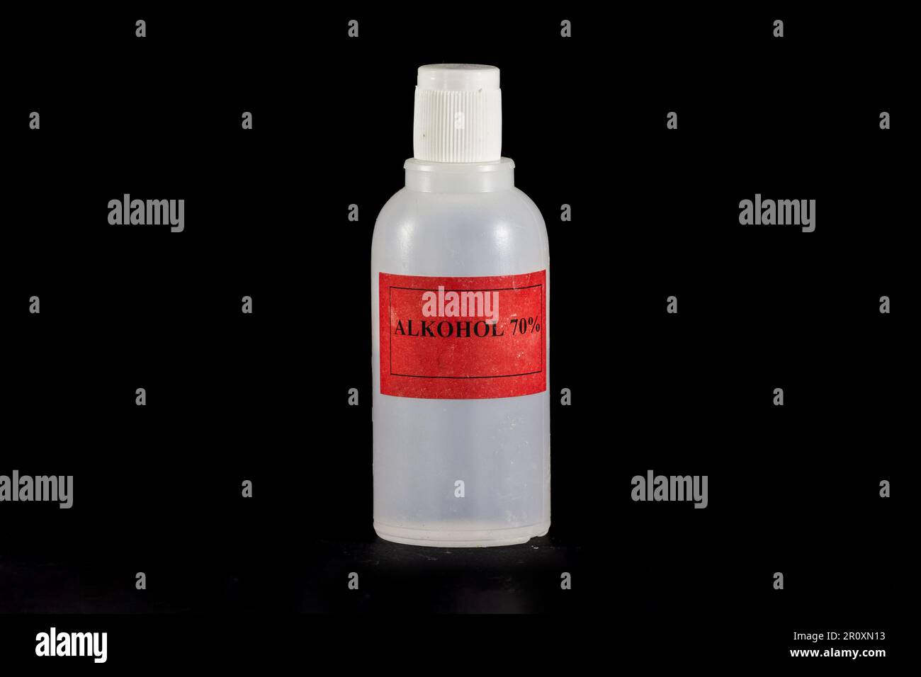 Picture of a 70 alcohol plastic bottle isolated on a black background