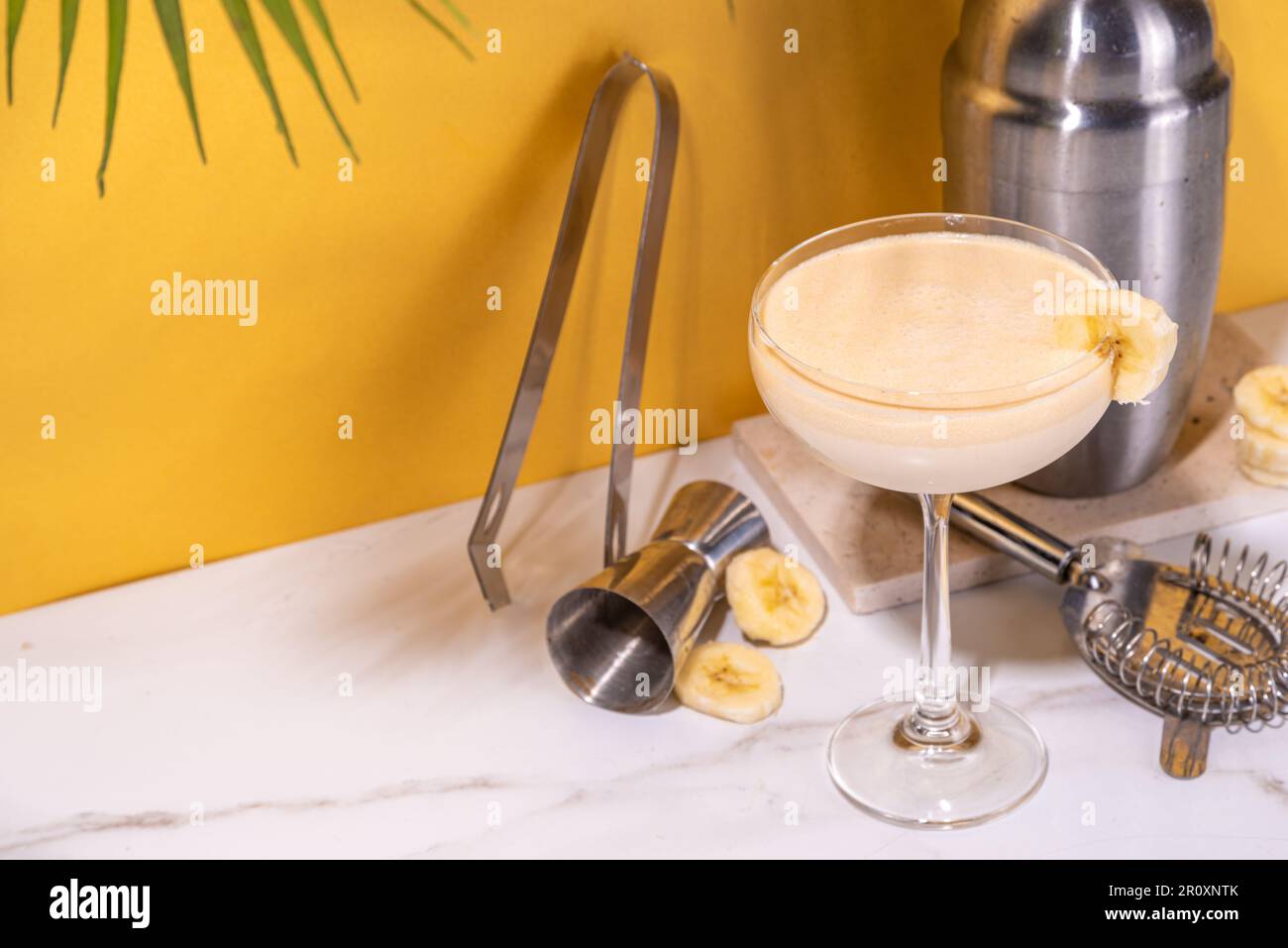 Sweet summer cold banana daiquiri or martini cocktail, liquor with