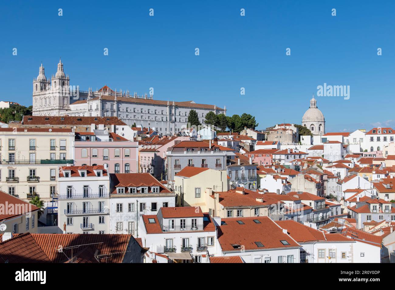 View of Alfama neighborhood Lisbon, Portugal with on hill Monastery of São Vicente de Fora and Church of Santa Engrácia (Igreja de Santa Engrácia) Stock Photo