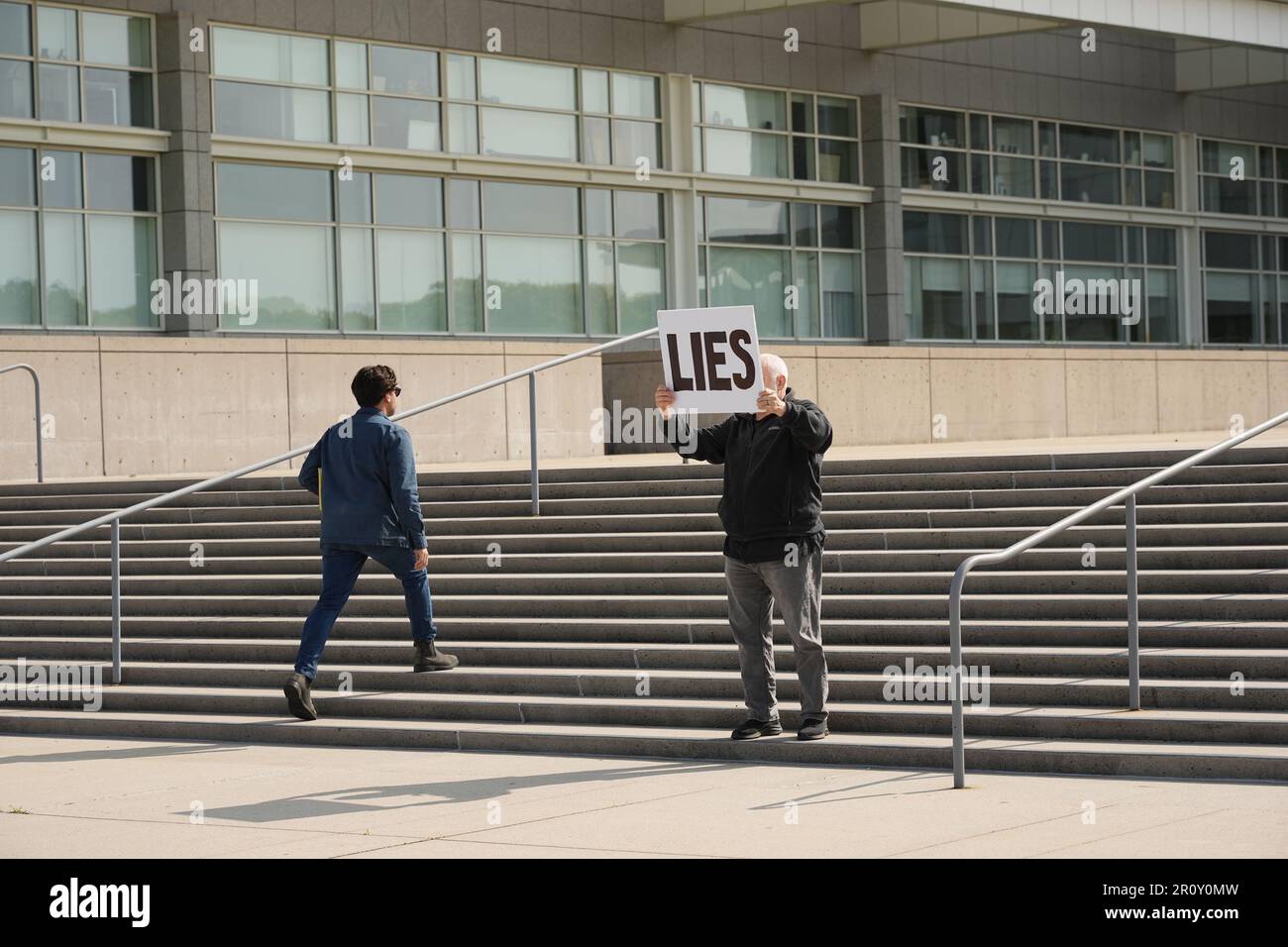 New York, United States. 10th May, 2023. A protestor pickets outside