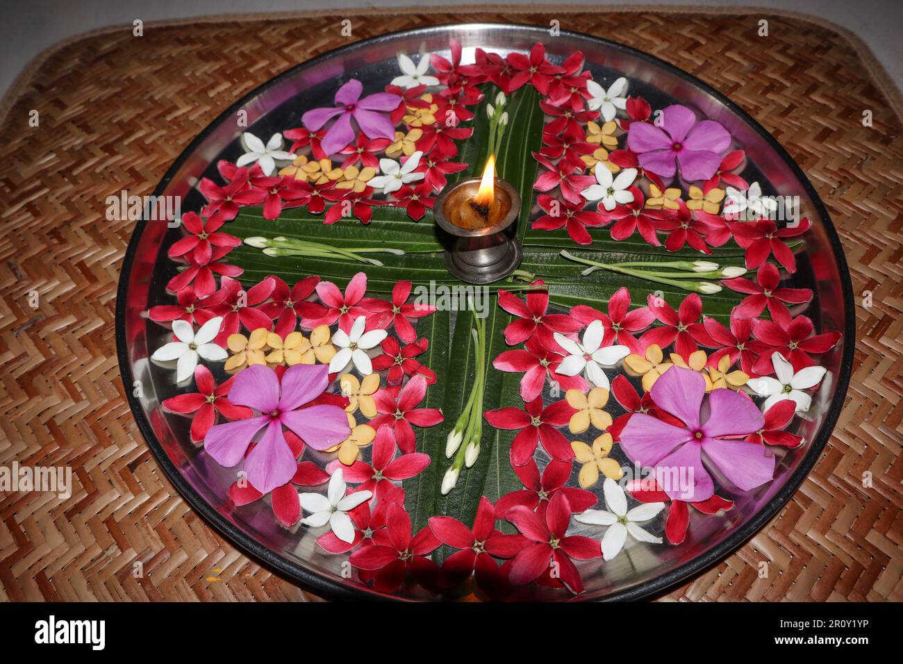 Aarti ki Thali or Puja thaali decorated with fresh flowers. Aarti thali