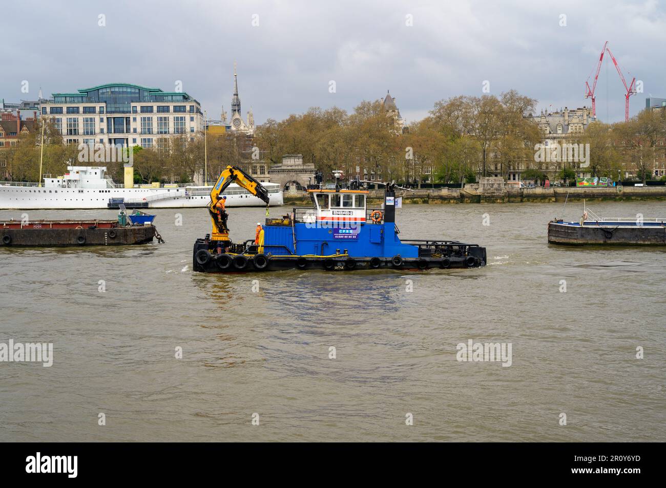 LONDON - April 21, 2023: Spot the M.P.V. Shakedog, a multi-cat support vessel, on the River Thames, contributing to the bustling maritime transportati Stock Photo