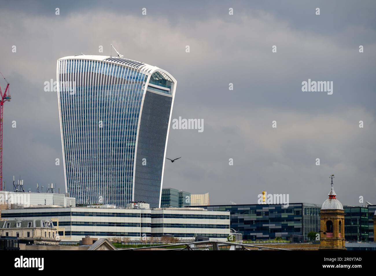 LONDON - April 21, 2023: The iconic Walkie Talkie building stands tall on a grey day in London's business district. Stock Photo